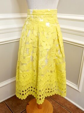 Antonio Melani yellow floral lace midi skirt with a high-waisted design